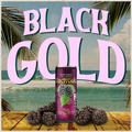 Can of Black Gold wine with blackberries on a beach background