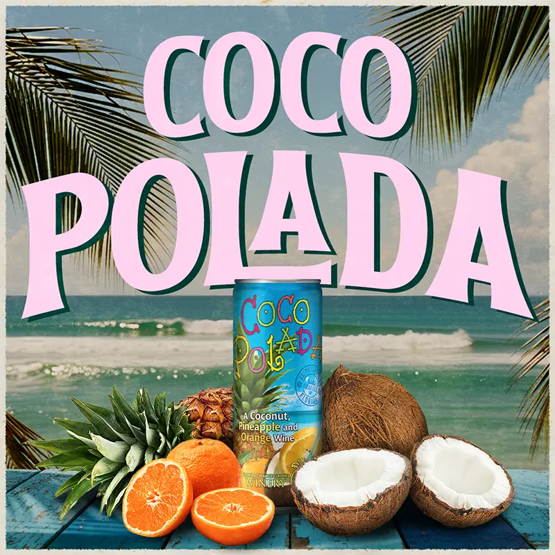 Coco Polada can with coconuts, oranges, and pineapple on a beach background