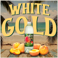 Bottle of White Gold peach wine with peaches on a beach setting