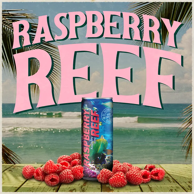Raspberry Reef can with raspberries on a beach background