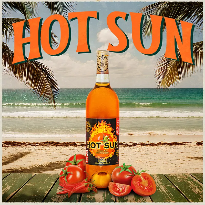 Bottle of 'Hot Sun' wine with tomatoes on a beach setting