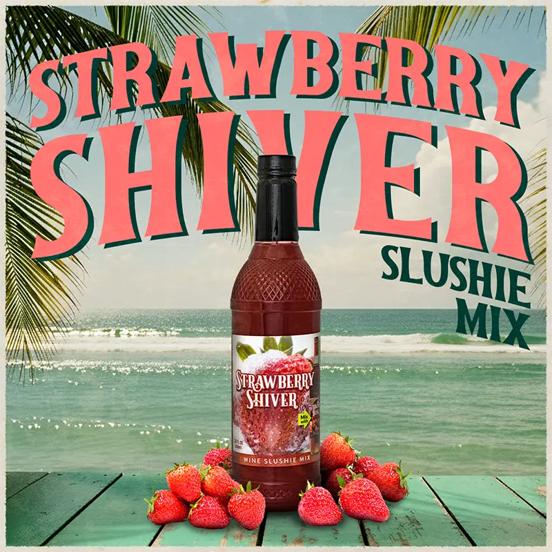 Bottle of Strawberry Shiver slushie mix with strawberries on a beach background
