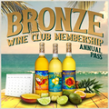 Promotional image for Bronze Wine Club Membership with wine bottles and tropical fruits on a beach background.